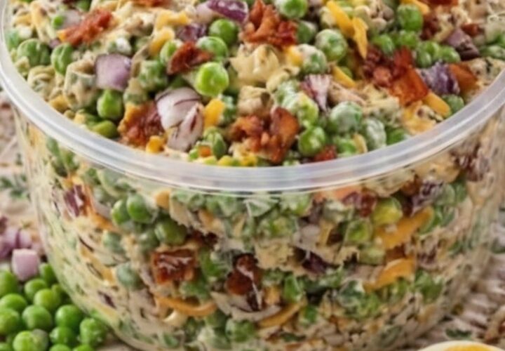 A creamy, sweet and savory cold salad made with frozen peas, crispy bacon, cheddar cheese, and tangy dressing. Perfect for potlucks, barbecues, and holiday gatherings.