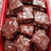 Rich, fudgy brownie bars topped with a smooth, glossy chocolate coating for the ultimate double chocolate dessert.