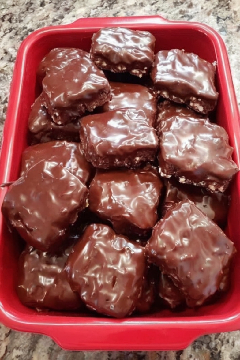 Rich, fudgy brownie bars topped with a smooth, glossy chocolate coating for the ultimate double chocolate dessert.