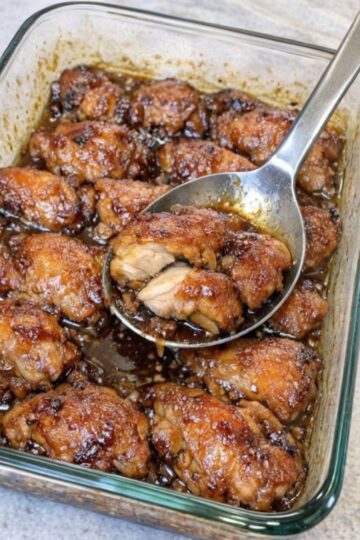 A sweet and savory baked chicken dish made with only three ingredients. Juicy chicken thighs coated in a caramelized brown sugar glaze with deep savory flavor. Perfect for potlucks and family dinners.
