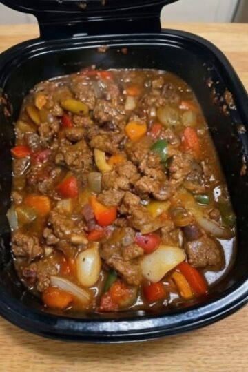 Tender beef slow-cooked with bell peppers and onions in a savory soy-ginger sauce. An easy crockpot dinner perfect for busy weeknights and family meal prep.