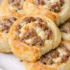These 3-Ingredient Sausage Cream Cheese Pinwheels combine flaky puff pastry with savory breakfast sausage and creamy cheese for the ultimate easy appetizer. Perfect for holiday entertaining, brunch menus, game day snacks, potluck recipes, family gatherings, and make-ahead party food, these buttery pinwheels bake into golden, crispy spirals with a rich, cheesy center everyone will love.