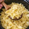 Slow Cooker Amish Sour Cream Noodles are the ultimate creamy comfort food made with tender egg noodles, sour cream, cottage cheese, cream cheese, and buttery seasonings for a rich homemade meal that's perfect for family dinners, meal prep, holiday gatherings, and budget-friendly comfort cooking. This easy slow cooker recipe creates a velvety, protein-rich side dish or vegetarian main course that pairs beautifully with roasted meats, fresh vegetables, and classic home-style favorites while delivering restaurant-quality flavor with minimal effort.
