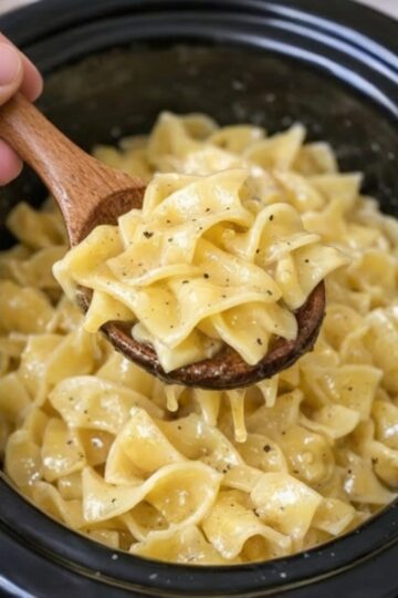 Slow Cooker Amish Sour Cream Noodles are the ultimate creamy comfort food made with tender egg noodles, sour cream, cottage cheese, cream cheese, and buttery seasonings for a rich homemade meal that's perfect for family dinners, meal prep, holiday gatherings, and budget-friendly comfort cooking. This easy slow cooker recipe creates a velvety, protein-rich side dish or vegetarian main course that pairs beautifully with roasted meats, fresh vegetables, and classic home-style favorites while delivering restaurant-quality flavor with minimal effort.