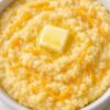 This Creamy Cheddar Polenta is a rich and buttery Italian-inspired comfort food made with chicken broth, yellow cornmeal, butter, and sharp cheddar cheese. Smooth, velvety, and packed with savory flavor, it's the perfect side dish for roasted meats, grilled chicken, steak, seafood, or vegetables. An easy 20-minute recipe that's both budget-friendly and restaurant-worthy.