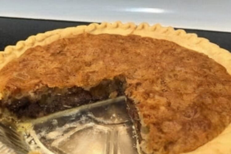 A classic Kentucky-style Derby Pie featuring a flaky buttery crust filled with rich chocolate chips, toasted pecans, vanilla, and a gooey brownie-like filling. Perfect for holidays, Derby parties, potlucks, Sunday dinners, and chocolate lovers.