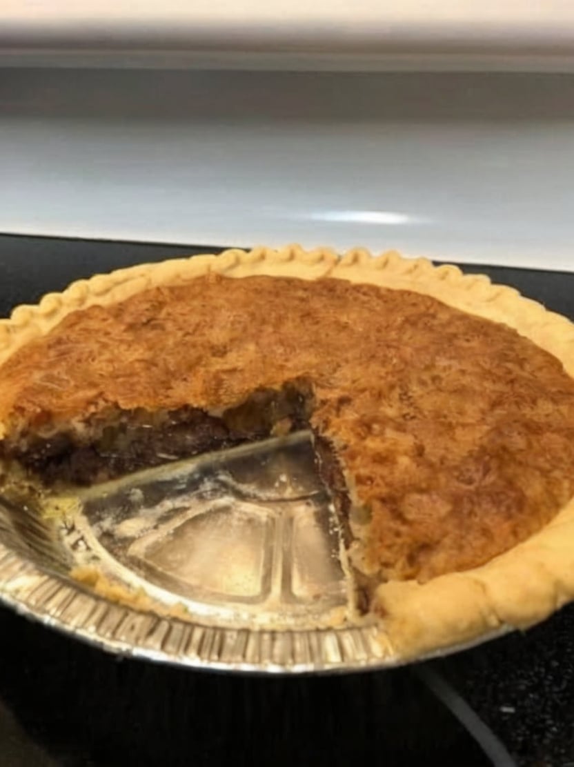 A classic Kentucky-style Derby Pie featuring a flaky buttery crust filled with rich chocolate chips, toasted pecans, vanilla, and a gooey brownie-like filling. Perfect for holidays, Derby parties, potlucks, Sunday dinners, and chocolate lovers.