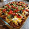 A cheesy keto taco casserole loaded with seasoned ground beef, cream cheese, sour cream, cheddar, and mozzarella. High in protein, low in carbs, and perfect for meal prep, weight loss goals, and easy family dinners.