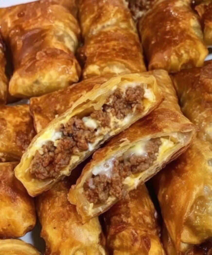 These Easy Puff Pastry Beef Rolls are filled with seasoned ground beef, cream cheese, onions, and garlic, then wrapped in flaky puff pastry and baked until beautifully golden. They're perfect for parties, holiday gatherings, game days, or a comforting family dinner.