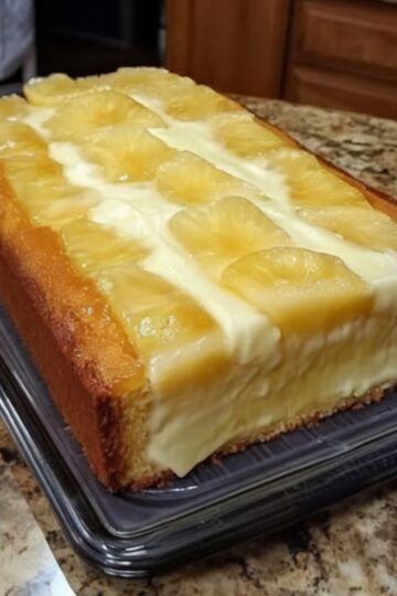 A rich and buttery Southern-style pound cake loaded with pineapple, cream cheese, and finished with a sweet pineapple glaze.