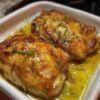An easy oven-baked chicken recipe featuring juicy chicken breasts coated in a creamy garlic Parmesan topping that bakes into a golden crust while creating a rich buttery pan sauce. Perfect for weeknight dinners, meal prep, and family comfort food.