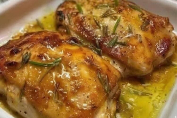 An easy oven-baked chicken recipe featuring juicy chicken breasts coated in a creamy garlic Parmesan topping that bakes into a golden crust while creating a rich buttery pan sauce. Perfect for weeknight dinners, meal prep, and family comfort food.