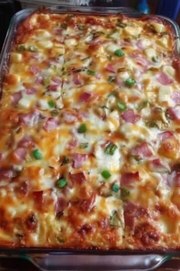 An easy breakfast casserole loaded with fluffy eggs, tender potatoes, savory ham, sautéed peppers, onions, and melted cheddar cheese. Perfect for brunch, meal prep, holidays, and family breakfasts.