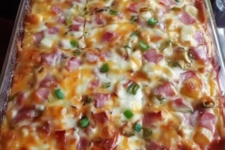 An easy breakfast casserole loaded with fluffy eggs, tender potatoes, savory ham, sautéed peppers, onions, and melted cheddar cheese. Perfect for brunch, meal prep, holidays, and family breakfasts.
