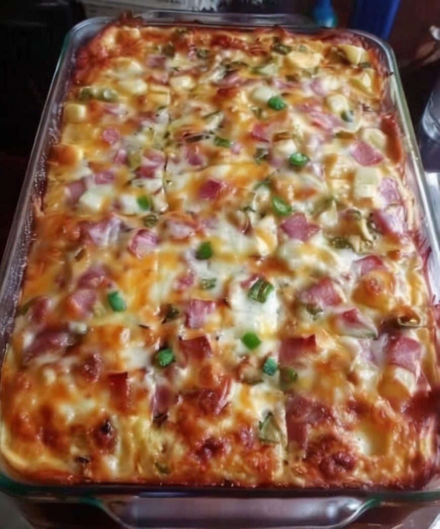 An easy breakfast casserole loaded with fluffy eggs, tender potatoes, savory ham, sautéed peppers, onions, and melted cheddar cheese. Perfect for brunch, meal prep, holidays, and family breakfasts.
