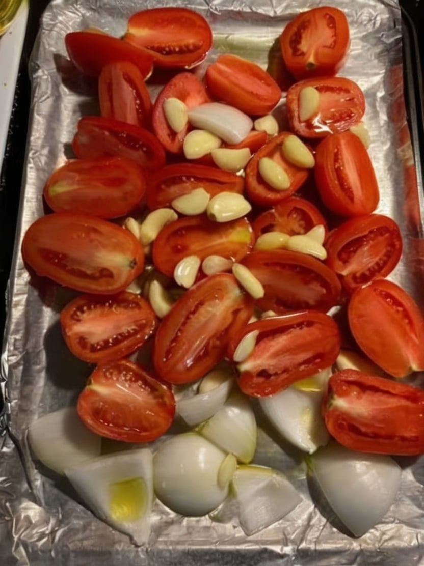 A rich homemade roasted tomato sauce made with fresh Roma tomatoes, roasted garlic, onions, basil, and olive oil. Perfect for pasta, pizza, lasagna, chicken, meal prep, and freezer-friendly family dinners.