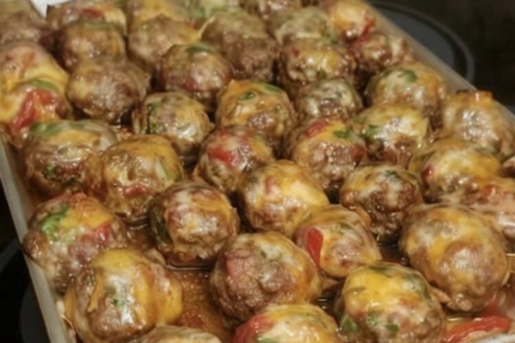 These Cheesy Baked Meatballs are tender, juicy, and topped with melted cheddar cheese, diced tomatoes, and sweet bell peppers. Ready in about 35 minutes, this easy one-pan dinner is perfect for busy weeknights or cozy family meals.