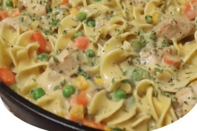 This Creamy Chicken Pot Pie Noodle Skillet combines tender chicken, egg noodles, peas, carrots, and a rich homemade cream sauce for an easy one-pan comfort food dinner. It has all the cozy flavors of classic chicken pot pie without the extra work of making a crust.