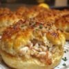 These Crab-Stuffed Cheddar Bay Biscuits feature fluffy cheddar biscuits filled with a creamy lump crab mixture and brushed with warm lemon garlic butter. They're perfect as seafood appetizers, brunch bites, or an easy restaurant-style dinner at home.