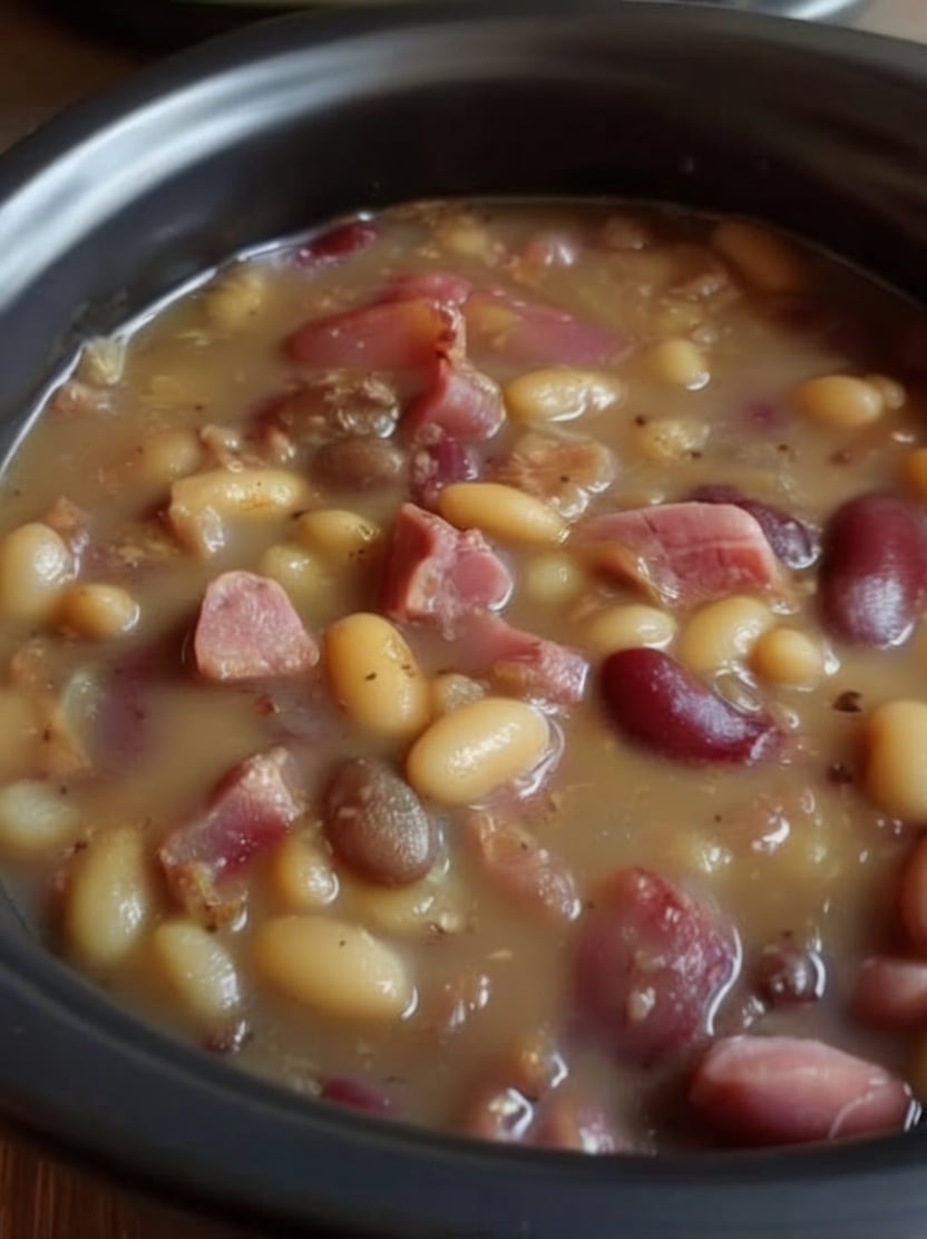 This Slow Cooker Ham and Bean Soup is packed with tender mixed beans, smoky ham, onions, garlic, and warm spices for a hearty, comforting meal. It's an easy dump-and-go recipe that's perfect for cozy family dinners, meal prep, or using leftover holiday ham.