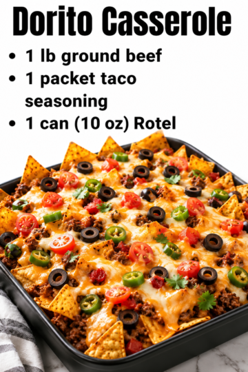 Dorito taco casserole baked in a 9x13 dish with seasoned ground beef, creamy Rotel sauce, crushed nacho cheese chips, melted cheddar, and fresh toppings.