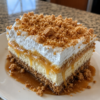 No-bake layered dessert bars with a buttery graham cracker crust, creamy cheesecake middle, rich butterscotch pudding, and whipped topping. Sweet, nostalgic, and crowd-pleasing.