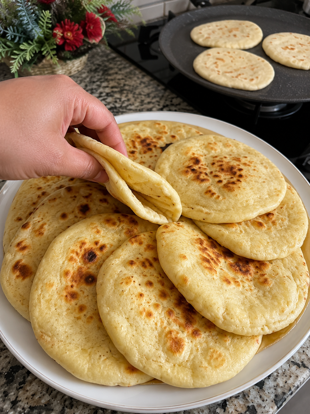 Incredibly soft, pillowy flatbread made on the stovetop in minutes. No long kneading or rising required—just mix, rest, roll, and cook until golden and puffed.