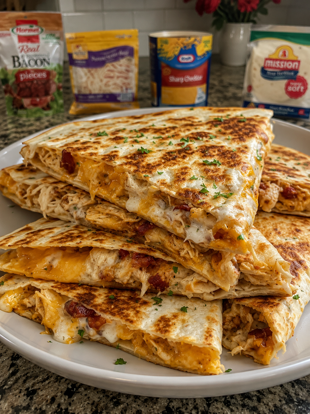 Quick, cheesy quesadillas loaded with ranch-coated chicken, crispy bacon, and two kinds of melted cheese. Ready in about 15 minutes for the ultimate easy weeknight dinner.