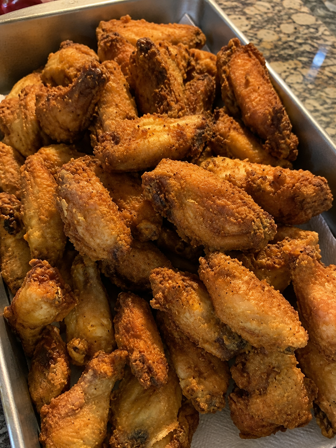 Shatteringly crispy fried chicken wings with a well-seasoned flour-and-cornstarch coating. Juicy inside, crunchy outside, and perfect served plain or with your favorite sauce.