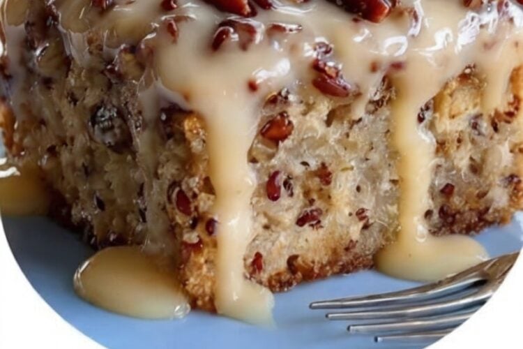 Soft butter pecan cake soaked with homemade praline sauce and finished with toasted pecans for an incredibly rich, buttery dessert that's perfect for holidays and family gatherings.