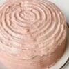 A classic buttery vanilla layer cake filled and frosted with naturally flavored strawberry buttercream made from freeze-dried strawberries. Perfect for birthdays, holidays, and special celebrations.