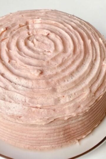 A classic buttery vanilla layer cake filled and frosted with naturally flavored strawberry buttercream made from freeze-dried strawberries. Perfect for birthdays, holidays, and special celebrations.