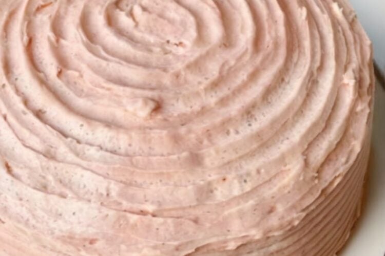 A classic buttery vanilla layer cake filled and frosted with naturally flavored strawberry buttercream made from freeze-dried strawberries. Perfect for birthdays, holidays, and special celebrations.