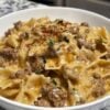 A rich and creamy one-pan pasta made with seasoned ground beef, garlic, Parmesan cheese, and tender bowtie pasta. The perfect comfort food for busy weeknights.