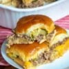 Tender seasoned ground beef layered with melted cheese and tangy pickles inside buttery baked slider buns for the ultimate easy family dinner.