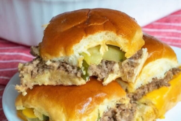 Tender seasoned ground beef layered with melted cheese and tangy pickles inside buttery baked slider buns for the ultimate easy family dinner.