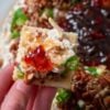 A creamy layered appetizer featuring cream cheese, sharp cheddar, toasted pecans, fresh green onions, and sweet pepper jelly. Perfect for holidays, parties, and family gatherings.
