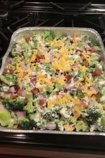 Crisp broccoli florets tossed with bacon, sharp cheddar, red onion, and a creamy sweet-tangy dressing. This easy summer side dish and potluck favorite is make-ahead friendly and always disappears fast at cookouts and BBQs.