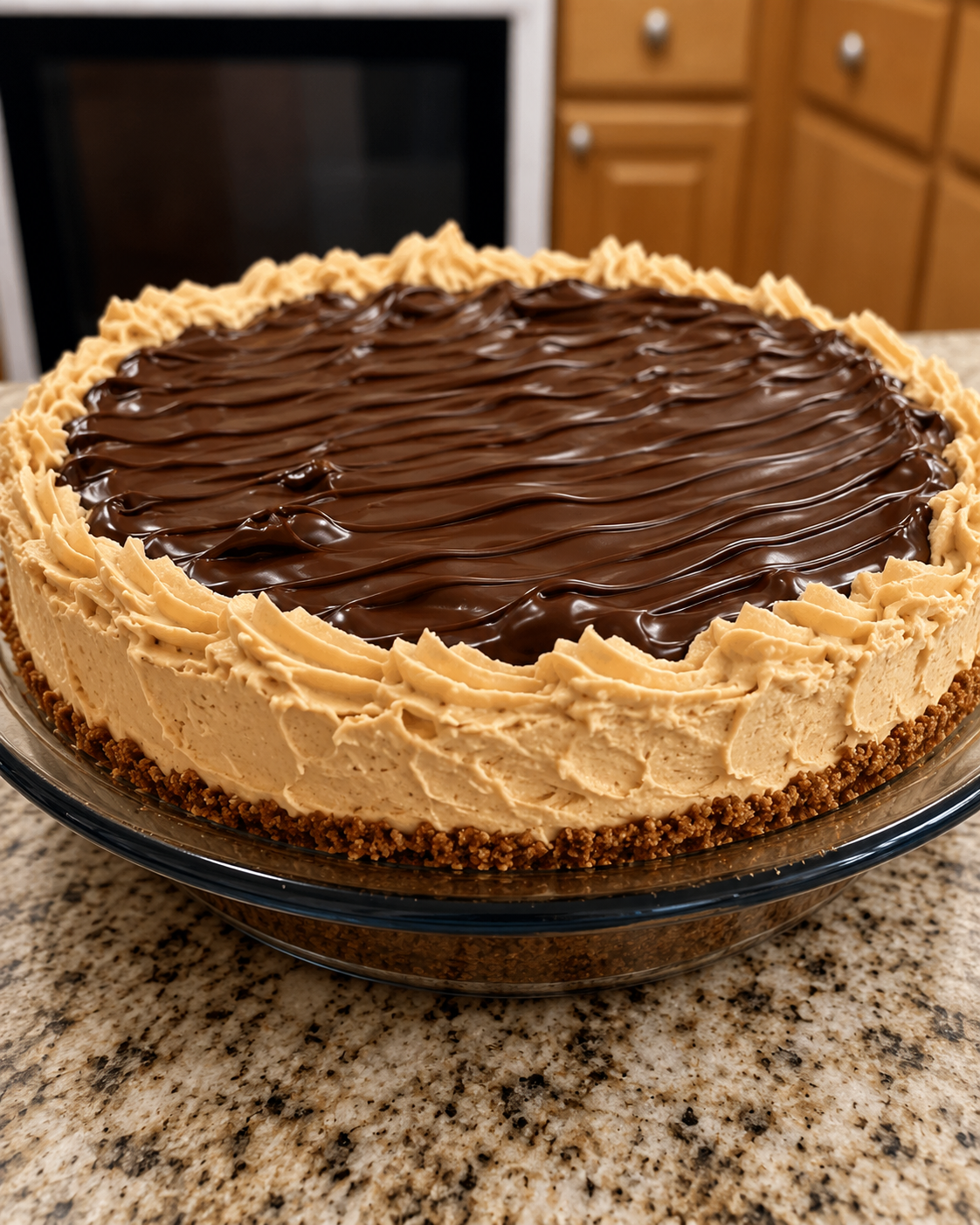 No-Bake Chocolate Peanut Butter Cream Pie with a buttery graham cracker crust, fluffy peanut butter cream filling, and a smooth, glossy chocolate ganache topping. This rich, creamy homemade dessert is chilled to perfection and garnished with chocolate shavings and peanut butter cups, making it an irresistible treat for holidays, parties, or summer gatherings.