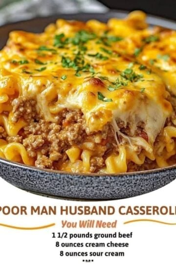 A hearty beef noodle casserole baked in a 9x13-inch dish with layers of tender egg noodles, seasoned ground beef in a rich tomato sauce, creamy cream cheese and sour cream filling, and a bubbling golden cheddar cheese topping. A serving is lifted onto a plate, revealing the creamy, cheesy layers, garnished with fresh parsley and photographed in warm natural light on a rustic w