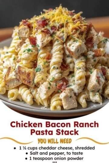 Creamy chicken bacon ranch pasta with tender chicken, crispy bacon, rotini pasta, melted cheddar cheese, and fresh parsley, served on a plate.
