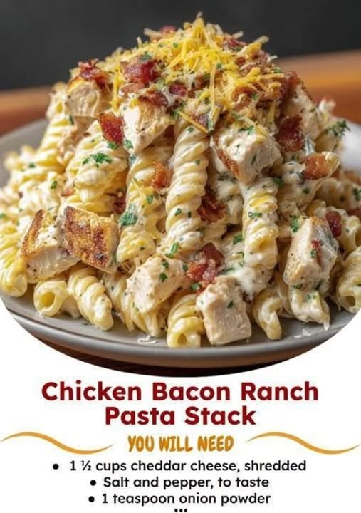 Creamy chicken bacon ranch pasta with tender chicken, crispy bacon, rotini pasta, melted cheddar cheese, and fresh parsley, served on a plate.