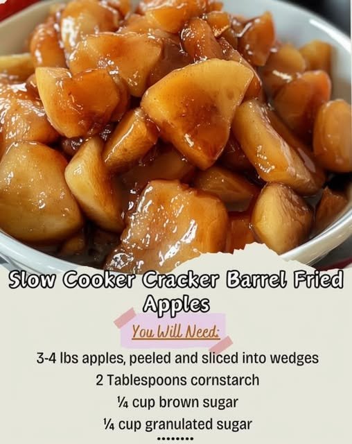 Slow cooker fried apples made with tender apple wedges coated in a glossy cinnamon-brown sugar caramel sauce, served warm in a bowl.