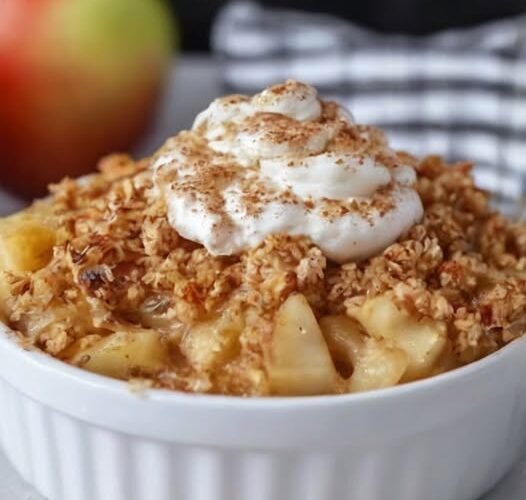 A warm cinnamon apple crisp made with tender sliced apples, topped with a golden, buttery oat crumble and lightly dusted with cinnamon.