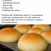 Freshly baked no-yeast mayo rolls with golden, lightly browned tops and soft, fluffy interiors, served warm in a rustic bread basket with melted butter. One roll is split open to reveal its tender, pillowy crumb, while the others are brushed with butter and arranged on a wooden farmhouse table in warm natural light for a cozy homemade dinner presentation.