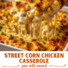A cheesy street corn chicken casserole topped with golden-browned melted cheese, sweet corn, tender shredded chicken, and fresh herbs, served hot and bubbling from the baking dish.