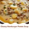 Creamy cheesy potato and beef soup made with tender diced potatoes, seasoned ground beef, onions, garlic, and a rich beef broth. Melted cheddar creates a smooth golden broth, finished with fresh parsley and served hot in a bowl as a cozy, hearty comfort meal.
