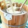 A golden-brown cinnamon apple crisp with tender baked apple slices beneath a crunchy oat and brown sugar crumble topping, served warm in a baking dish.