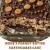 A rich Reese's Peanut Butter Earthquake Cake baked in a 9x13-inch pan with swirls of creamy peanut butter cheesecake running through moist chocolate cake. Topped with silky chocolate ganache, mini Reese's peanut butter cups, and chocolate chips, one slice is lifted to reveal the gooey marbled layers inside. Served on a rustic wooden table in warm natural light for an indulgent bakery-style dessert presentation.