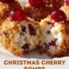 A festive platter of bite-sized cherry coconut treats, with creamy white centers speckled with cherries, coated in toasted golden coconut, and topped with bright red maraschino cherries.